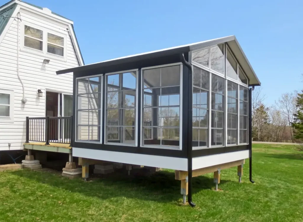 4-track vinyl sunroom addition with full screen panels for airflow and protection from greenhead flies and mosquitoes